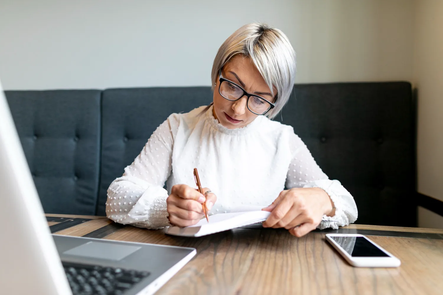 Expert grant writer reviewing funder playbooks to ensure professional grant writing service compliance