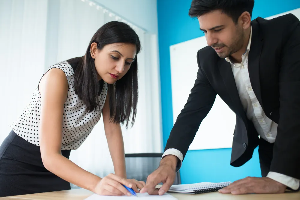 Two Professionals In a meeting and Making strategies related to grant writing service