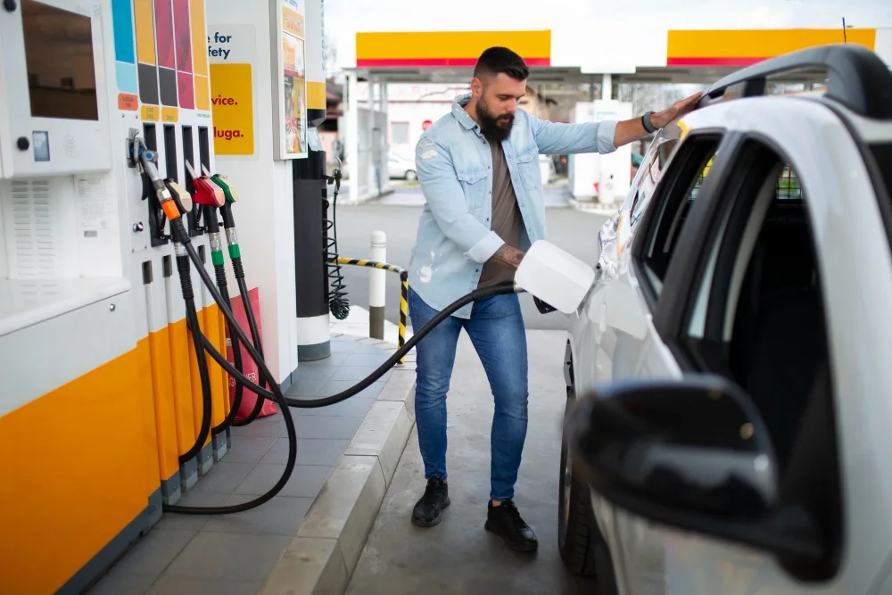 Vehicle being filled at a petrol pump as part of AFAS Gas Grant financial assistance for active-duty Army families.