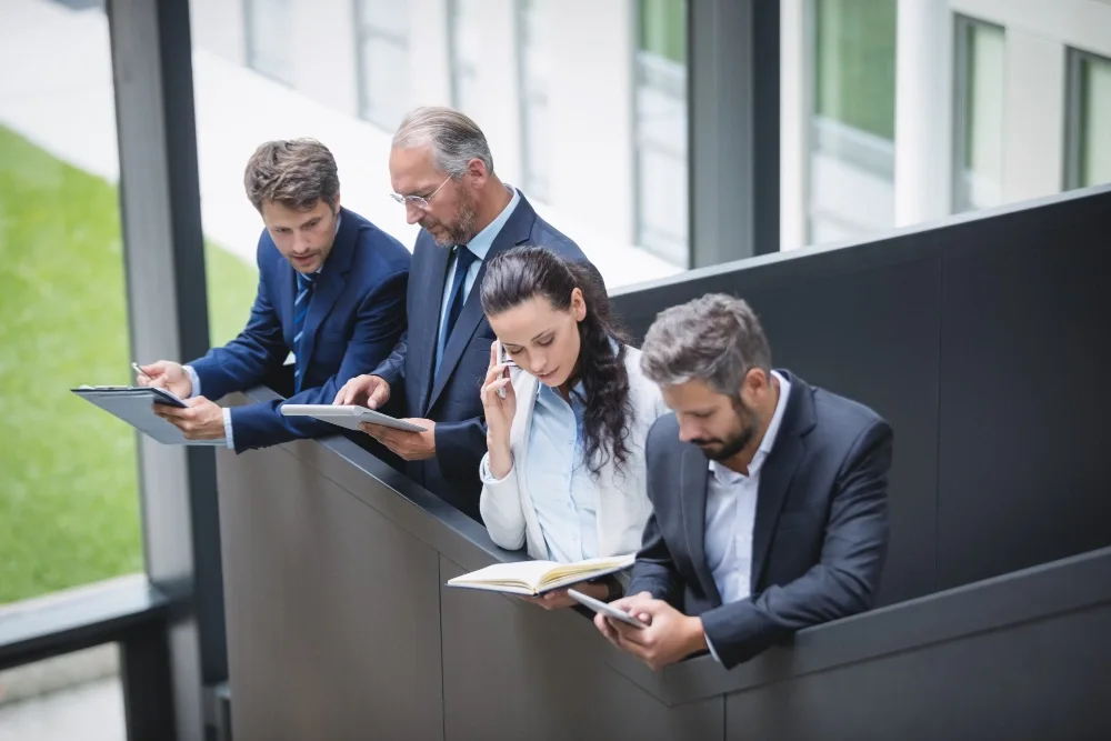 Government officials meeting in a federal office as they review policy updates related to the DOGE humanities grants ruling next decision.
