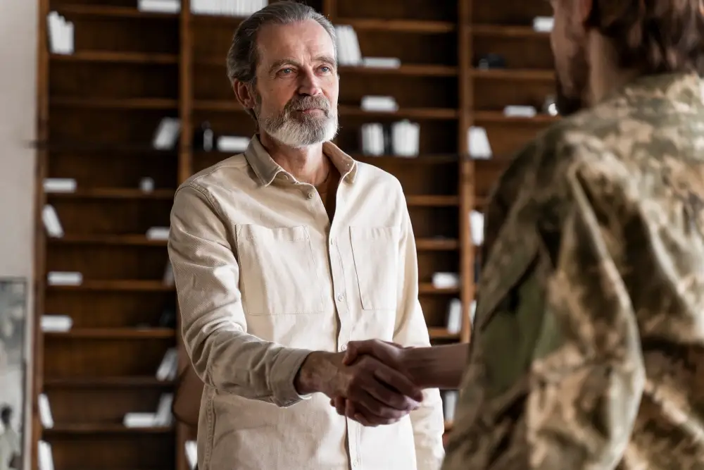 Warrior University $20,000 Veteran Business Grants shaking hands